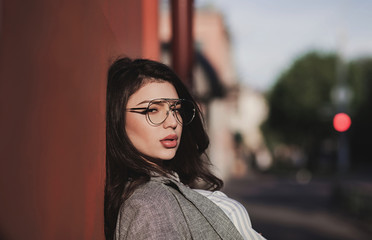 Stylish woman with full lips in glasses