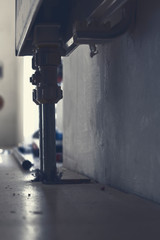 Connection valves under a radiator, on the floor much dust and dirt from the renovation