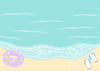 Fototapeta na wymiar 浮き輪とビーチサンダルのあるビーチ　海と砂浜
