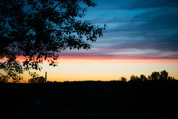 Early summer sunrise over the village, the colorful sky, Russia