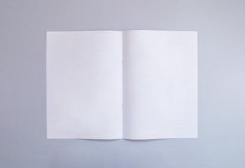 Blank portrait A4, US-Letter, brochure or magazine isolated on gray background