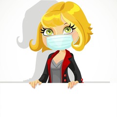 Cute blond girl in face mask holding a large horizontal banner isolated on a white background