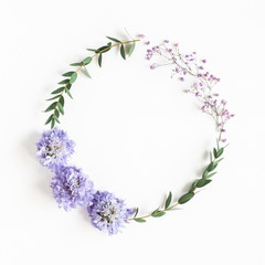 Flowers composition. Wreath made of gypsophila flowers, eucalyptus leaves on white background. Spring concept. Flat lay, top view, copy space