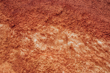 Nature background of cracked dry lands. Natural texture of soil with cracks. Broken clay surface of barren dryland wasteland close-up. Full frame to terrain with arid climate. Lifeless desert on earth