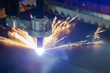 plasma cutting machine cuts metal sparks fly