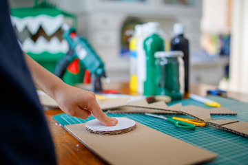 Cardboard project , boys playing at home