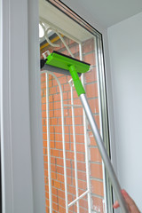 cleaning Windows at home by yourself with rags, sponges and detergents, spring cleaning of the house
