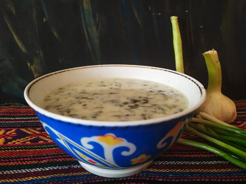 Creamy soup dovga filled with herbs
