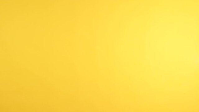 Asian woman waving hello or goodbye to camera and slowly disappear down