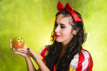 Woman dressed as fairytale character holds Radioactive atomic nuclear ionizing radiation danger...