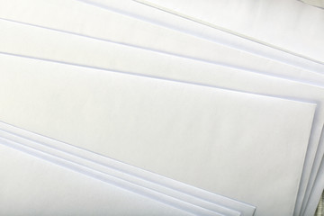 close up of stack of white letters or papers.