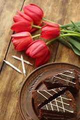 holiday table, quarantined birthday, cake with a candle, chocolate cake. View from above
