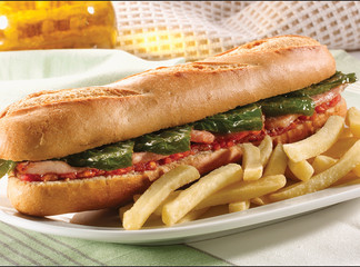 sandwich, baguette de lomo y pimientos de cerca y patatas fritas. sandwich, loin baguette and...
