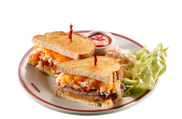 sandwich de carne queso y verduras con salsa picante. meat cheese and vegetable sandwich with spicy sauce
