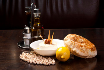 The traditional Middle Eastern , hummus with tahini, served with Egyptian flat bread.