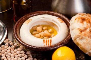 The traditional Middle Eastern , hummus with tahini, served with Egyptian flat bread.