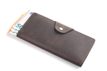 Brown leather wallet with euro banknotes isolated on white