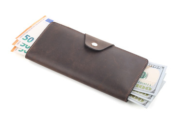 Brown leather wallet with euro and dollars banknotes isolated on white
