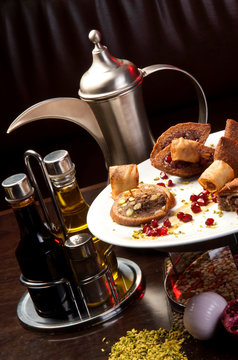 Arabic traditional tea pot and oriental quibe plate.