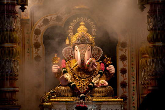 Dagdusheth Ganapati Idol at pune with golden jewellery in the aarti time  with smoke and beautiful decoration in 2019 Stock Photo | Adobe Stock
