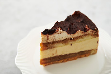 Piece of tiramisu cake on plate
