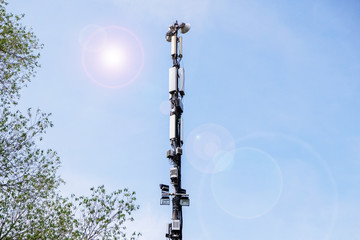 Telecommunication tower of 4G and 5G cellular. Cell Site Base Station. Wireless Communication Antenna Transmitter. Telecommunication tower with antennas against blue sky background