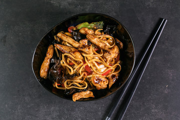 Stir fry chicken, sweet peppers. wok