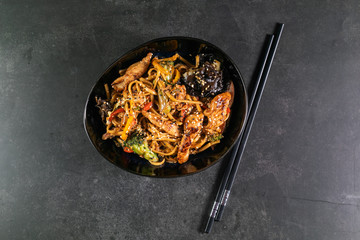 Asian noodles with meat on plate
