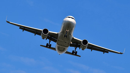 Fototapeta na wymiar Aircraft on blue sky background