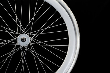 Close-up to a white wheel of a bicycle