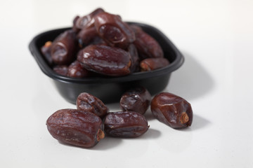 Dried dates fruits on white background, tasted sweet and chewy