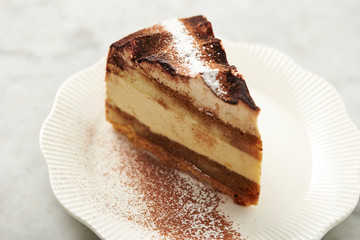 Piece of tiramisu cake on plate