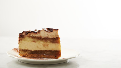 Piece of tiramisu cake on plate