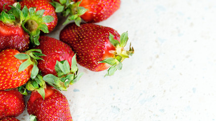 Freshly picked strawberries from the home garden. Natural organic food production. Heap of summer red berries. Homegrown, gardening and agriculture concept. Close up. Soft focus