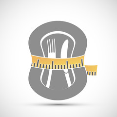 Measuring tailor tape around plate with knife and fork