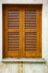 Window with closed wooden shutters.