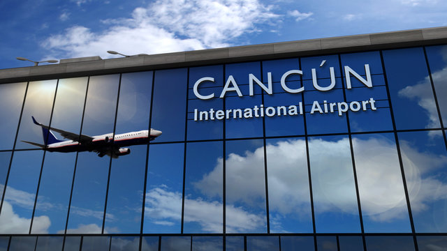 Airplane landing at Canc&uacute;n Mexico mirrored in terminal