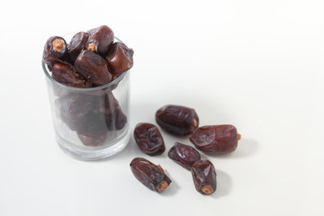 Dried dates fruits on white background, tasted sweet and chewy