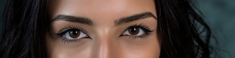 close-up photo of woman eye with eyeliner makeup   on white background.