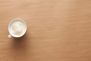 Obraz na płótnie Canvas Single coffee on a brown empty background. Copy space.