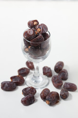 Dried dates fruits on white background, tasted sweet and chewy