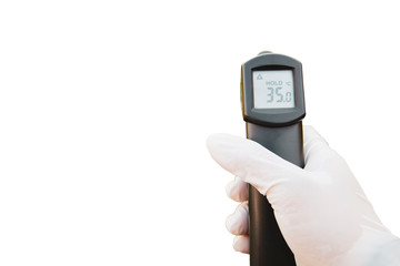 Woman's hand wearing rubber gloves, holding digital infrared thermometer, reading 35 degrees...