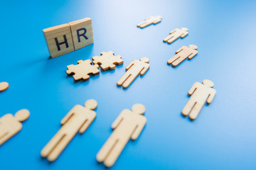 Human resources, corporate hierarchy concept and multilevel marketing - recruiter complete team represented by wooden cube by one leader person (CEO) and icon.