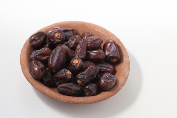 Dried dates fruits on white background, tasted sweet and chewy