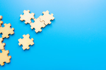 image of wooden blocks with people icons over blue table ,human resources and management concept. Puzzles