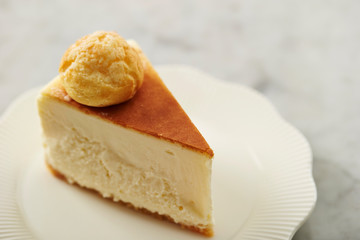 Small profiterole on cheese cake