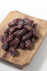 Dried dates fruits on white background, tasted sweet and chewy