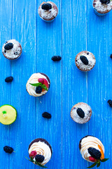 Freshly baked sweet muffins on a blue background. Sweet pastries, recipes, cooking