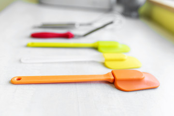 Set of multi-colored silicone spatulas, kitchen tools. Sweet pastries, recipes, cooking