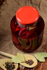 chopped beets with spices in a large jar to make silage at home